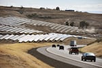 Sunlight reflects off solar panels west of Pendleton, Oregon, along Interstate 84.