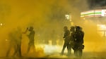 Police use tear gas and impact munitions to disperse protesters in downtown Portland during 4th of July demonstrations against systemic racism and police violence. 