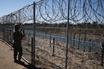 A U.S. Army soldier monitors the border with Mexico in Eagle Pass, Texas, last week. President Trump ordered 1,500 more active military personnel to the southern border, part of a broad immigration crackdown during his first week in office.