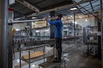 A worker stands stands in the factory where beer is produced at Murree Brewery on Nov. 29, 2025 in Rawalpindi, Pakistan.