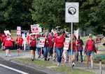 Members and supporters of the Camas Education Association demonstrate outside of Camas High School on Aug. 28, 2023. The strike appears to be the school district's first ever, according to union and district officials.