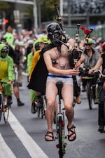 The Unipiper, a well-known Oregon street performer, cycles down Martin Luther King Jr. Boulevard in Portland, Ore. on Sunday, Oct. 12, 2025.