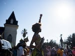 Prescylia Mae raises her fist in the air during a Juneteenth re-enactment celebration in Galveston, Texas, on June 19, 2021.