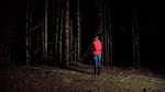 Biological science technician Alaina Thomas during a night survey, listening for the hoot of a spotted owl. 