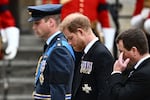 Britain's Prince William, Prince of Wales (L) and Britain's Prince Harry (C), Duke of Sussex arrive at Westminster Abbey.