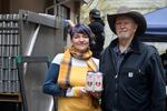 Three Magnets Brewing co-owner Sara Reilly and her father Jim Elsner, a blood transfusion recipient, pose on the canning line with the limited run It Takes All Types Red IPA.