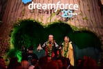 Danny Akaka Jr. and Anna Akaka address attendees during Salesforce's 2022 Dreamforce conference in San Francisco. Danny, the son of late U.S. Sen. Daniel Akaka, and Anna have been spiritual advisers to Benioff.