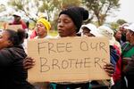 Relatives and friends protest near a reformed gold mineshaft where illegal miners are trapped in Stilfontein, South Africa, Nov. 15.