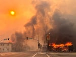 Flames from the wind-driven Eaton Fire engulf a house in Altadena, Calif., on Jan. 8, 2025.