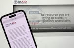 In this photo illustration, a message appears on the U.S. Agency for International Development (USAID) website on Feb. 5. The Trump administration issued a directive late Tuesday night that all USAID direct hire personnel will be placed on administrative leave globally, and the administration will terminate contracts that are not determined to be essential. (Photo Illustration by Justin Sullivan/Getty Images)
