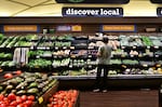 A man shops for produce at a supermarket in Monterey Park, California.