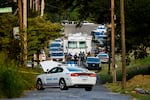 Memphis police officers search an area where a body had been found in South Memphis, Tenn., on Monday.