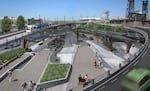 Rendered photos of the skatepark by DAO Architecture. The image shows pedestrians overlooking skateboarders from a walkway.  Triangular, origami-like roofing cover much of the park area. Underneath, skateboarders can be seen on ramps, bowls, and pipes.