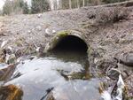A 2018 photo shows a culvert along Tawes Creek, under State Route 9 north of Van Zandt, Wash.