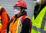 Maria Ramirez listens to instructions between practice rounds of a Portland Neighborhood Emergency Teams training session.