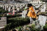 A Yemeni girl visits the graves of Houthis during Eid al-Fitr marking the end of the holy fasting month of Ramadan in Sanaa, Yemen, Sunday, March 30, 2025.