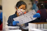 An election worker sorts mail-in ballots at the Multnomah County Duniway-Lovejoy Elections Building Monday, Nov. 2, 2020, in Portland, Ore. (AP Photo/Marcio Jose Sanchez)