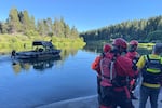 This photo provided by the Deschutes County Sheriff's Office shows search and rescue teams on the Deschutes River about 10 miles from Bend, Ore., after a fatal waterfall accident Saturday, July 19, 2025.