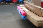 Pool noodles are taped to the back of Stefanie Lynch's car to protect it from contestants at the second annual parallel parking competition in Southeast Portland, Ore., Aug. 30, 2026. Contestants were disqualified if they bumped into any cars or curbs while parking.