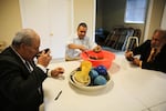 Community leader Kolini Fusitu'a along with other men gather for a Kava Circle after service at the Lents Tongan Fellowship of the United Methodist Church