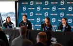 Seattle Torrent team captain Hilary Knight, second to left, speaks at a press conference inside the Space Needle about winning her second gold medal at the winter Olympic games in Milan. Knight scored 15 goals and 33 points in Olympic competition, the most by any U.S. hockey player at the games.
