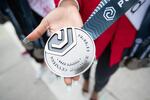 The Portland Marathon medals are handed out at the finish line on October 6, 2019.