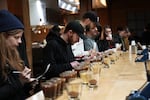 Local baristas and coffee aficionados participate in a cupping competition at Proud Mary Café in Portland, Ore., on Feb. 3, 2023, for a chance to win a cup of Black Jaguar Geisha from the Hartmann Estate in Panama. The award-winning roast sold at auction for $2,000 a pound.