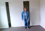 Marcela Selwyn checks out the closet space as she tours one of 24 new homes constructed by the Confederated Tribes of Grand Ronde on Dec. 11, 2023, in Grand Ronde. Selwyn has lived in the community for 17 years and will be getting one of these climate-resilient single-family homes in February 2024. 