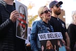 Protestors outside Bend City Hall on Oct. 3 carried pictures of Nathan Boddie's face with the text "Bend Deserves Better."