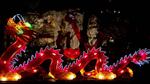 Lan Su's 20-foot dragon illuminates the lake during the lantern festival.