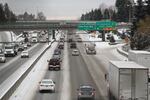 Drivers navigate an icy Interstate 5 the day have a strong storm dumped between 1 to 3 inches in the Portland area, Dec. 15, 2016