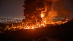 Fire and smoke rise after an Israeli attack on the Shahran oil depot on June 15 in Tehran, Iran.