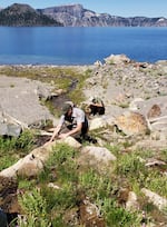 Two biologists Buktenica sample some of the many springs that empty into Crater Lake.