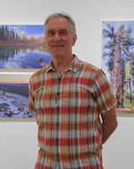 Landscape photographer Peter Marbach in front of his “Century of Wonder” photo exhibit at the Oregon Historical Society Museum, July 21, 2022. Marbach worked on this project for over two years, and went to state parks all over the state to capture the difference in landscapes Oregon has to offer.