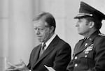 FILE - President Jimmy Carter attends memorial services for eight servicemen killed in the unsuccessful attempt to rescue the American hostages from Iran, May 9, 1980, at Arlington National Cemetery in Arlington, Va.