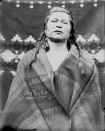 "Portrait (Front) of Chief Big Foot in Native Dress; Blanket Hanging in Background 1900"