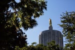 Sun glints off the pioneer atop the Oregon Capitol building in Salem, Ore., Saturday, June 29, 2019. Republican senators returned to the Capitol after a nine-day walkout in order to finish Senate business before the June 30 deadline.