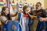 Chinook council woman, Rachel Cushman and chairman, Tony Johnson, gift a blanket to Shoalwater Bay Indian Tribe chairwoman, Charlene Nelson, during a council-to-council meeting July 2023. Nelson has since retired from her position as chairwoman.