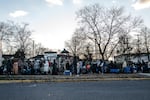 People stand in line at the No Limits Food Pantry for free groceries.