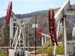Oil pumpjacks operate near Ventura, Calif., on Aug. 5. Oil producers have ramped up output after crude prices surged this year.