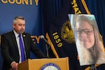 Multnomah County District Attorney Nathan Vasquez stands next to a picture of Elizabeth Gibson, the latest victim allegedly killed by Jesse Lee Calhoun, in Portland, Ore., on Sept. 16, 2026.