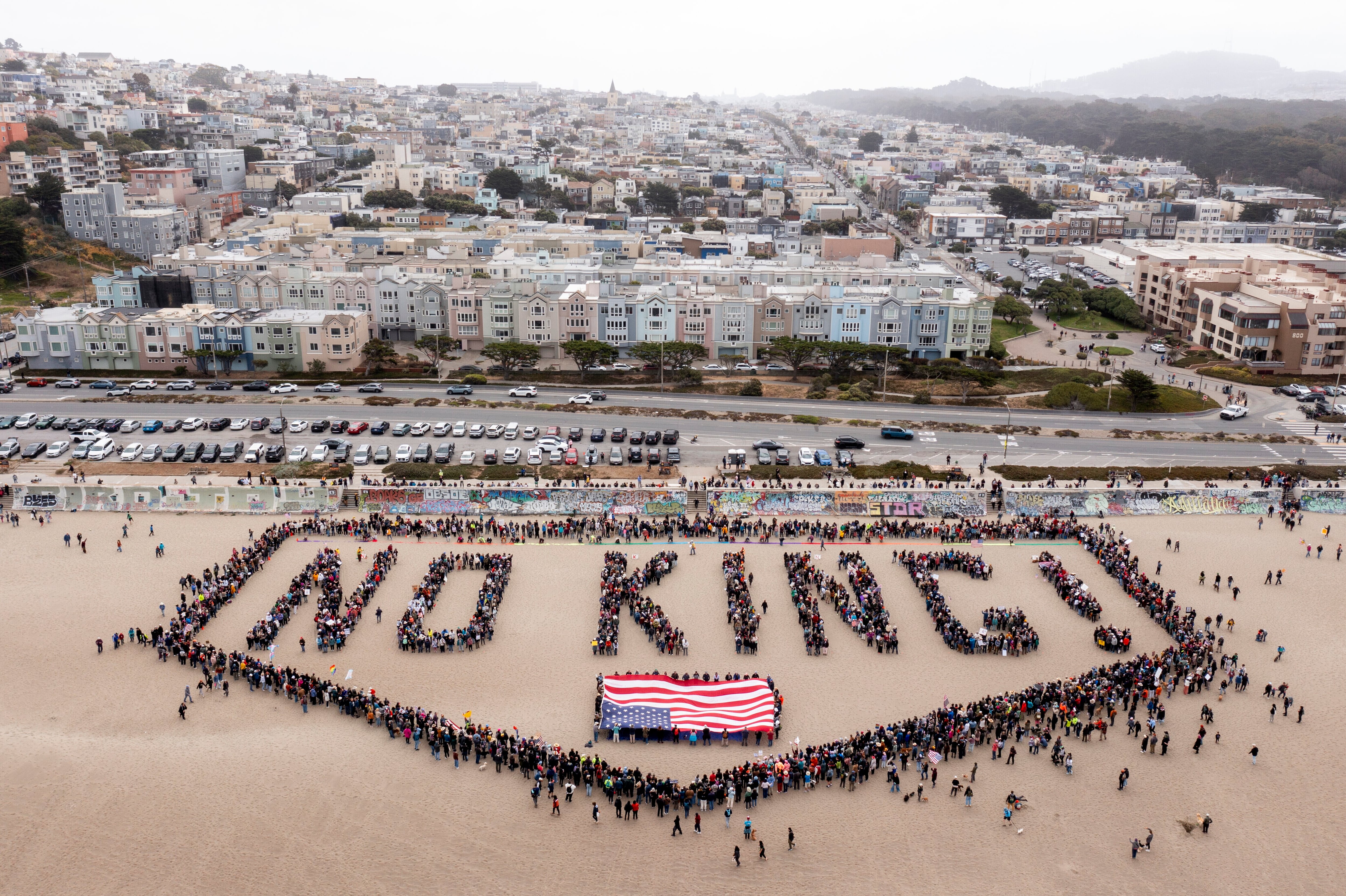 San Francisco: People form a human banner at Ocean Beach.