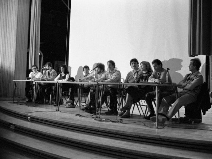 Alan and Chic Canfora, among others, take place in a panel discussion during the 15th Annual May 4 Commemoration in 1985.