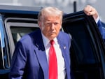 Republican presidential nominee, former President Donald Trump, arrives at Harry Reid International Airport to board a plane after a campaign trip on Saturday in Las Vegas.