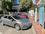 Electric vehicles line up at Downtown Portland's Electric Ave. The space offers EV drivers fast chargers for many different charging ports.