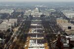 Attendees line the Mall as they watch ceremonies to swear in Donald Trump on Inauguration Day on Jan. 20, 2017, in Washington, D.C.