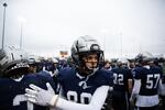 Lake Oswego's Benjamin Taylor pats his teammate on the back during the second half of the Oregon 6A football championship at Hillsboro Stadium in Hillsboro, Ore., Saturday, Dec. 7, 2019. Central Catholic defeated Lake Oswego 49-28.