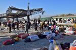 Security officials examine the site of a bomb explosion at railway station in Quetta, southwestern Pakistan on Saturday.