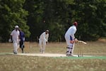Sumeet Batish bowls to Harjinder Sardar in a cricket match between the Portland Spartans and Multnomah Cricket Club, two of close to a dozen teams that make up the Oregon Cricket League.