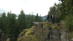 Carol Logan, Wilbur Slockish and Johnny Jackson stand on the edge of a cliff at Enola Hill, a sacred Native American site near Mount Hood. 